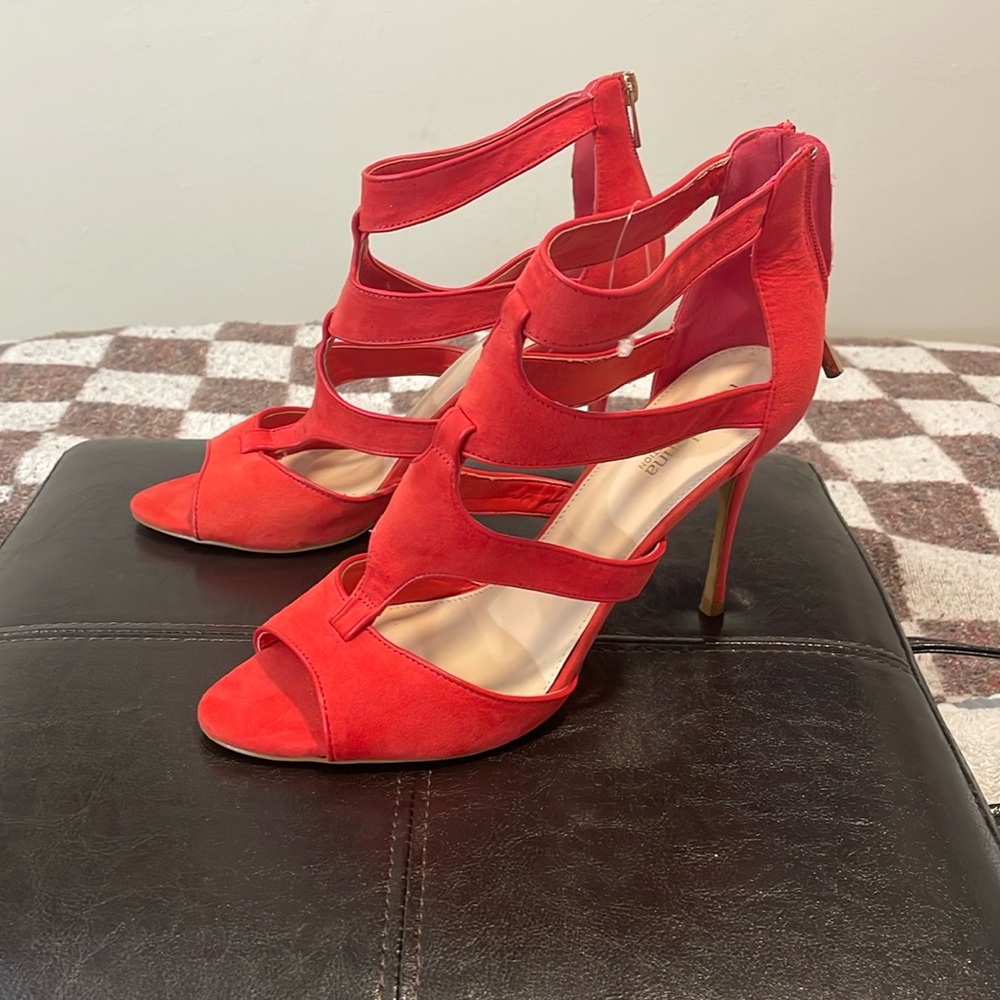 Size ten coral colored high heeled sandals.